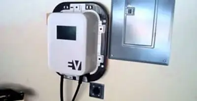 Electric car charger installation with wall-mounted EV charging station in Fort Wayne, IN
