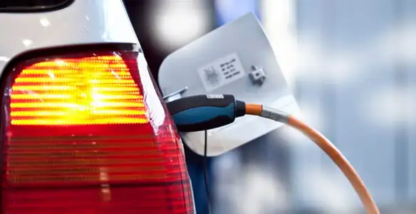 Electric car plugged into EV charger after professional installation in Fort Wayne, IN