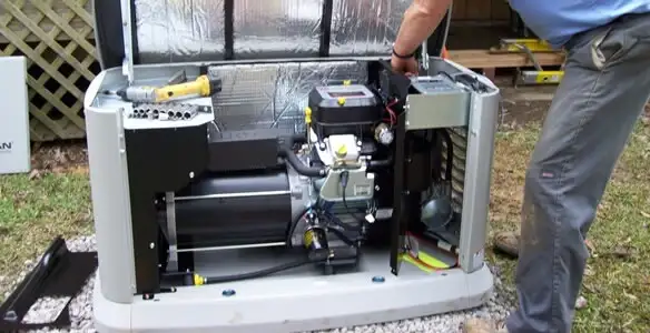 generator installation service showing technician connecting and configuring generator components in Fort Wayne, IN