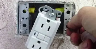 gfci circuits service showing installation of a ground fault circuit interrupter outlet by licensed electricians in Fort Wayne, IN