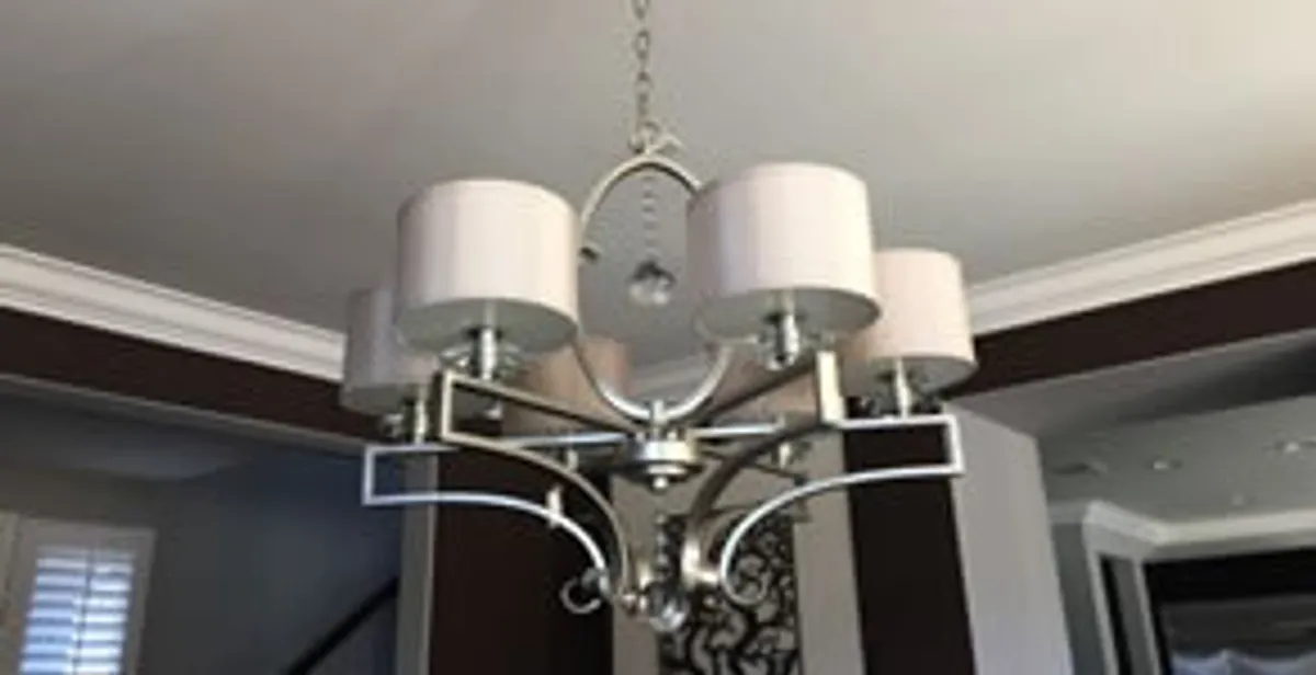 Modern chandelier installation with multiple light fixtures in Fort Wayne, IN