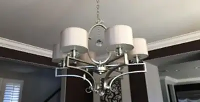 Modern chandelier installation with multiple light fixtures in Fort Wayne, IN