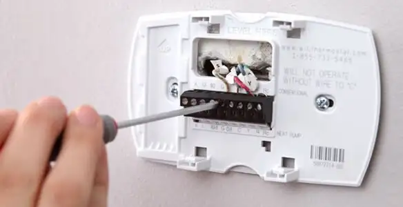 Thermostat installation service with proper wiring and secure wall mounting in Fort Wayne, IN
