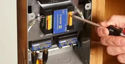 Whole home surge protection device being installed by a licensed electrician to protect electrical systems in Fort Wayne, IN